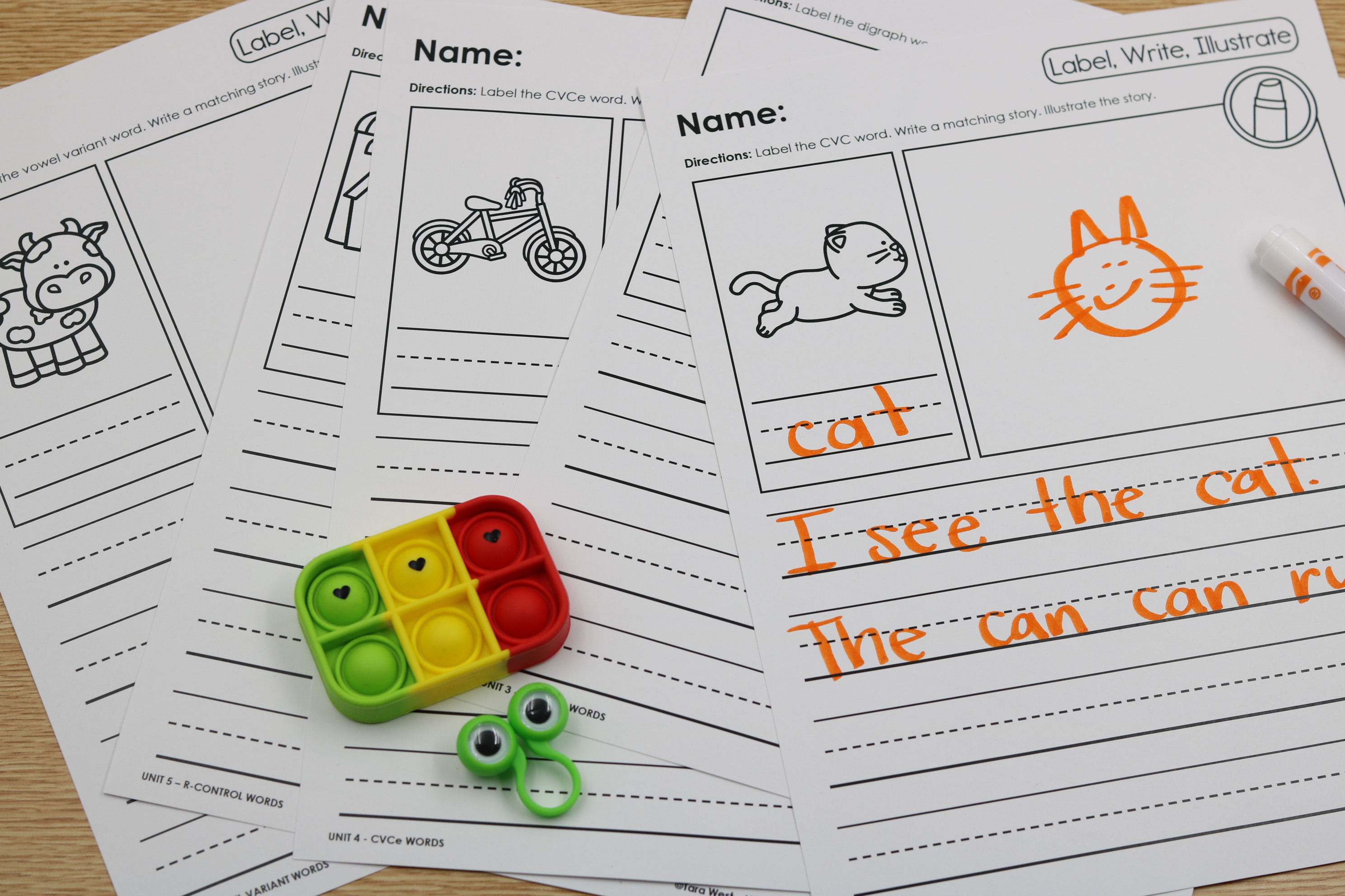 Free phonics-based writing pages with label, write, and illustrate activities
