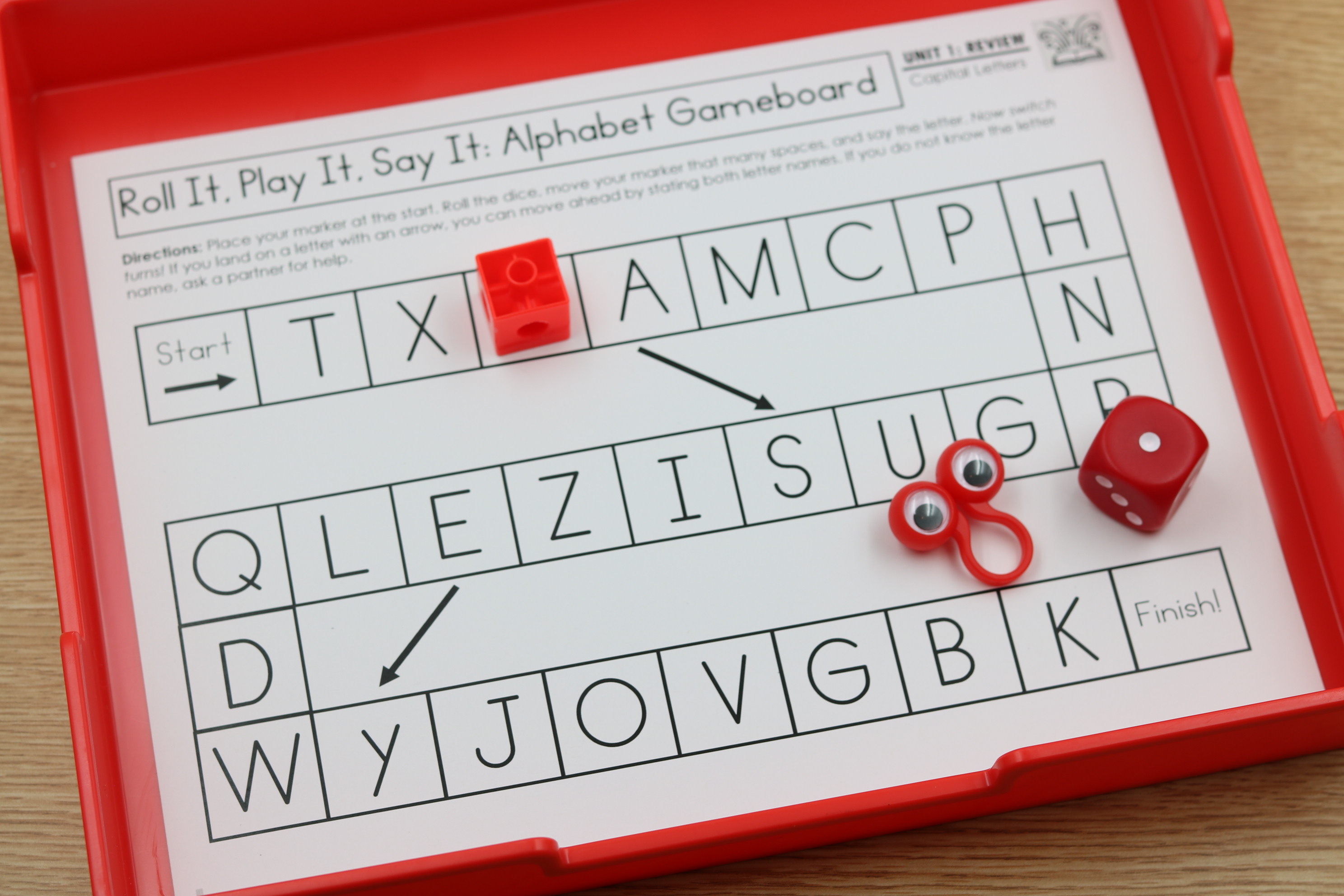 Printable alphabet gameboards with roll and play activities for capital and lowercase letters.