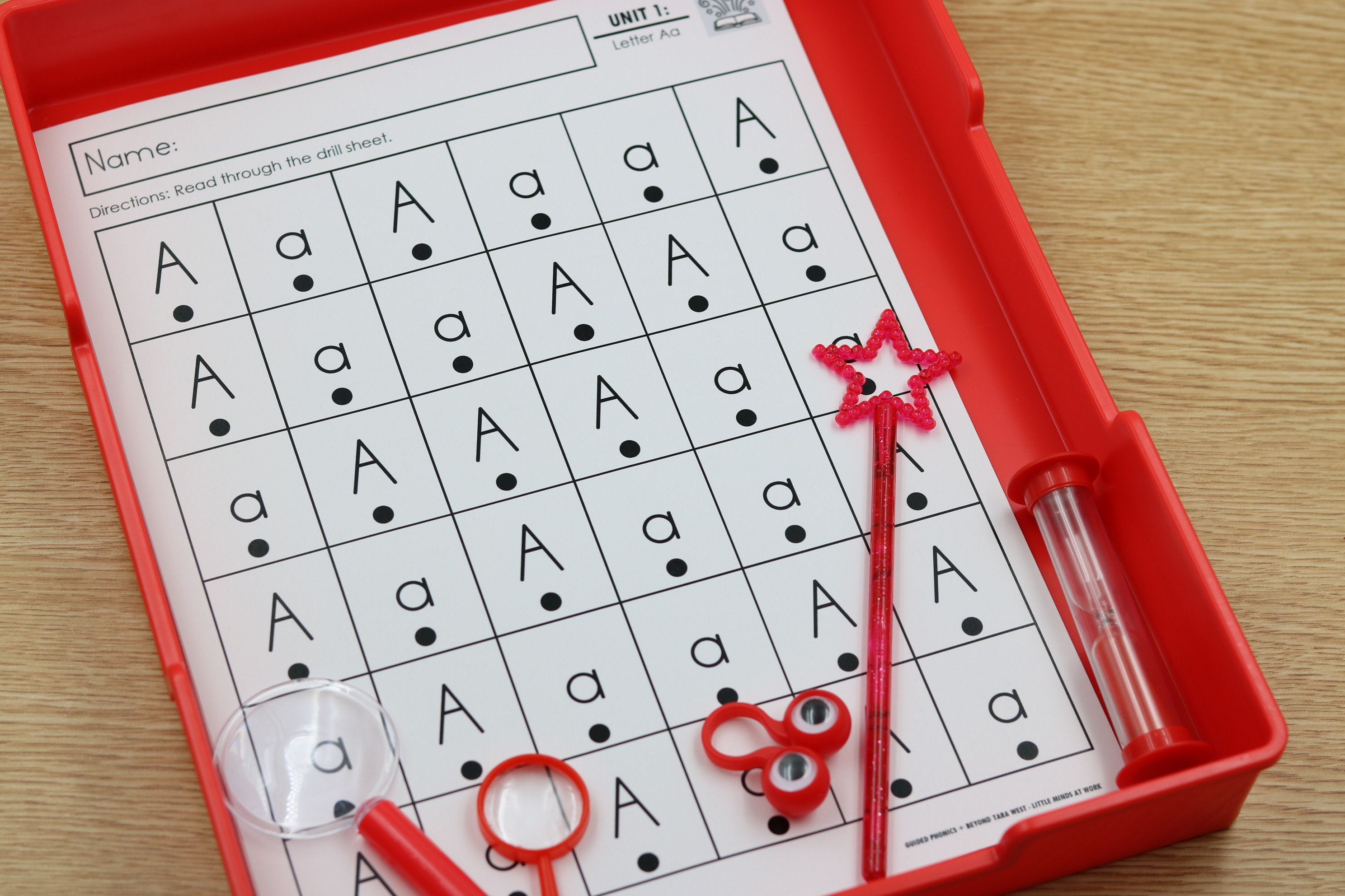 Alphabet fluency grids for timed letter naming practice, aligned to two scope and sequence options.