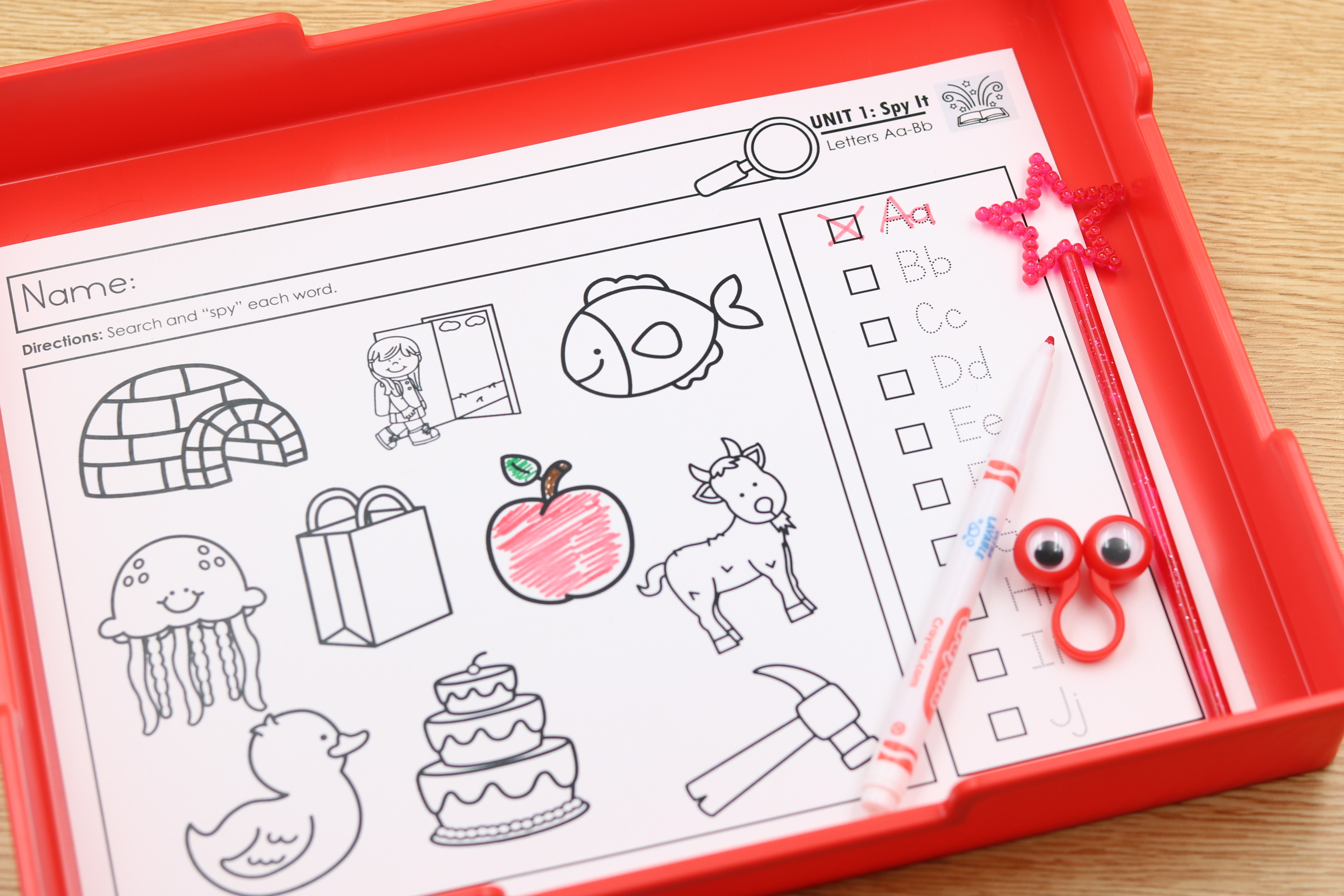 Alphabet “I Spy” worksheet with pictures and matching letters for phonics-based letter recognition.