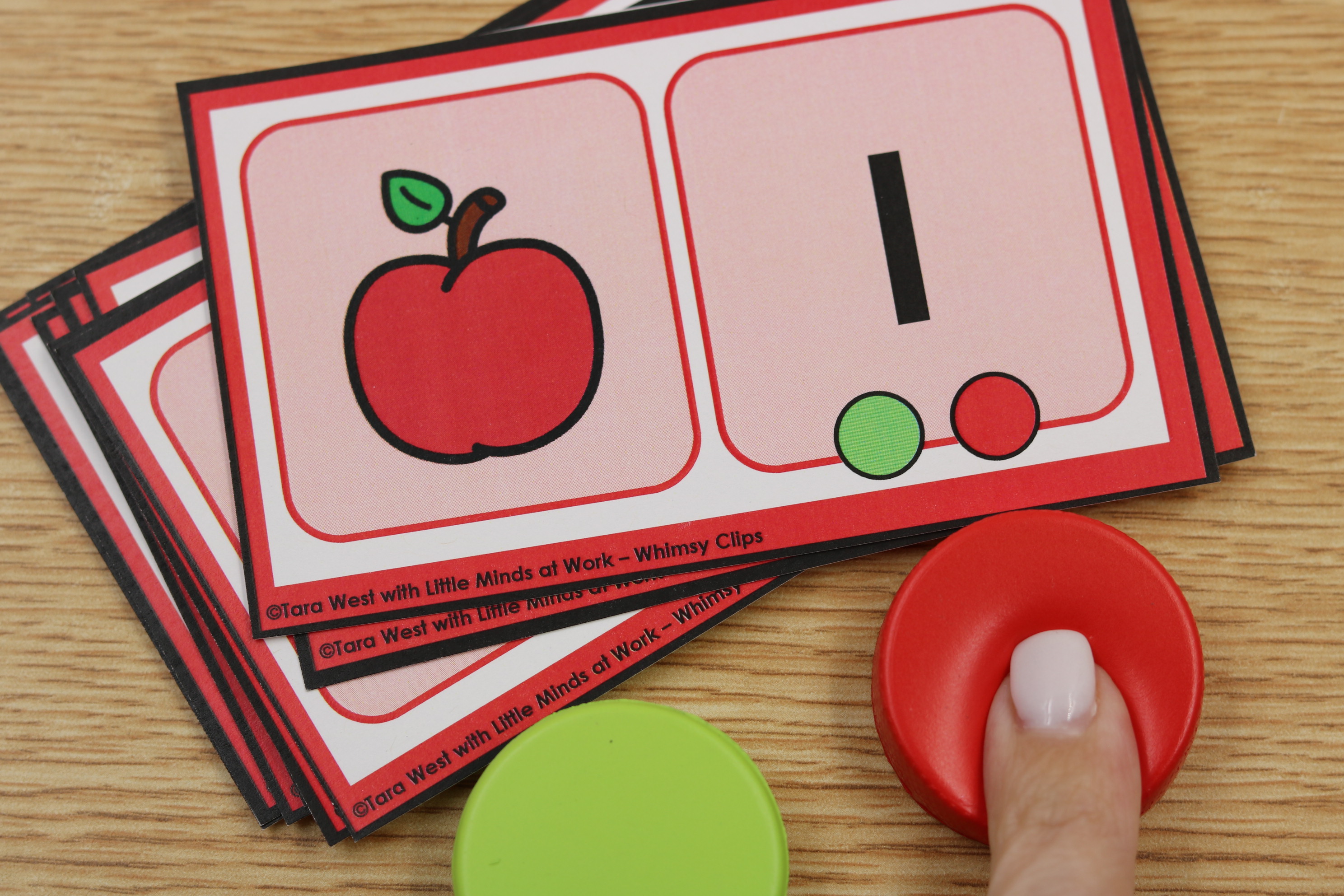 Isolated sounds task cards for identifying beginning or ending sounds using color-coded manipulatives.