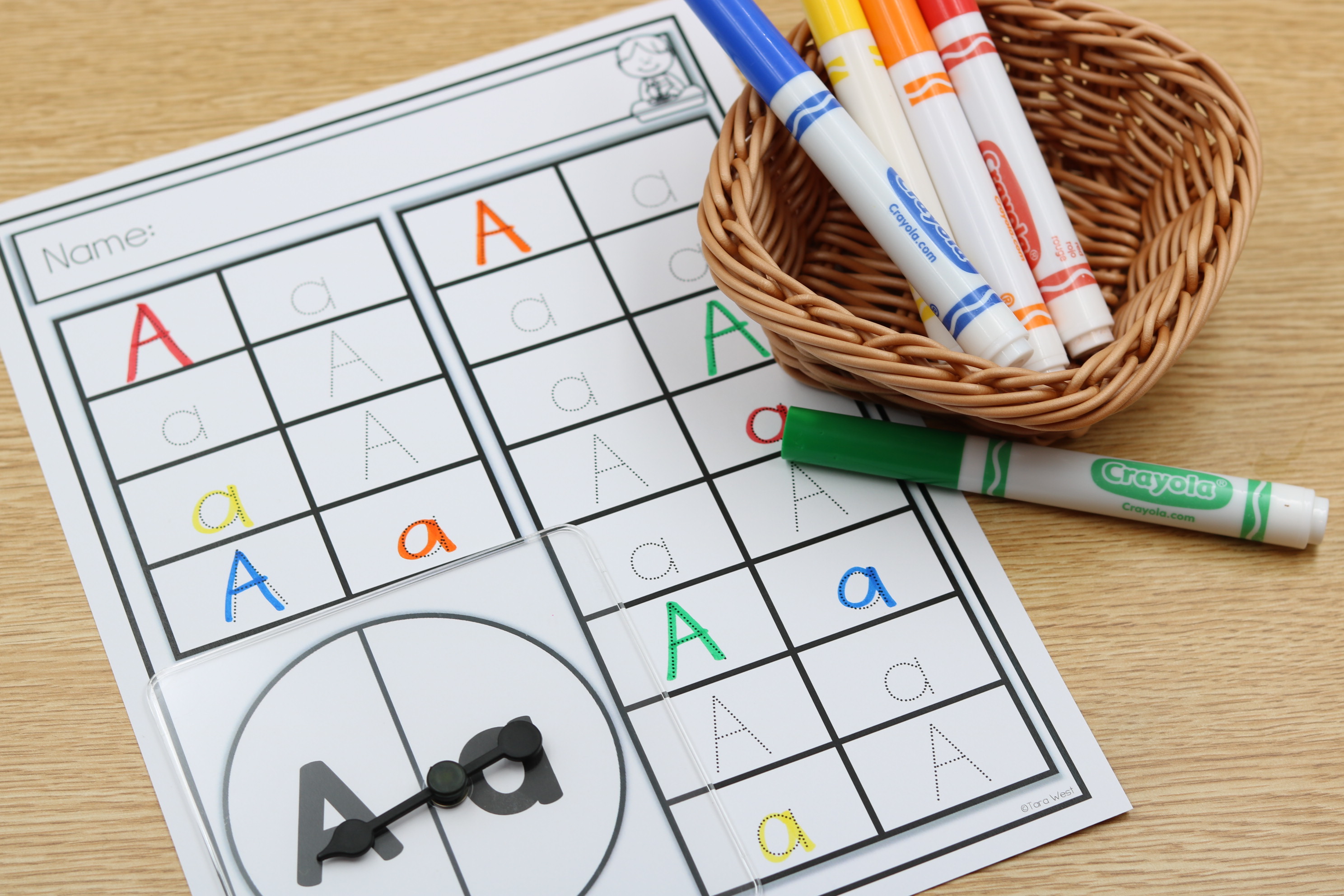 Alphabet spin and trace mat with capital and lowercase letter practice for early learners.
