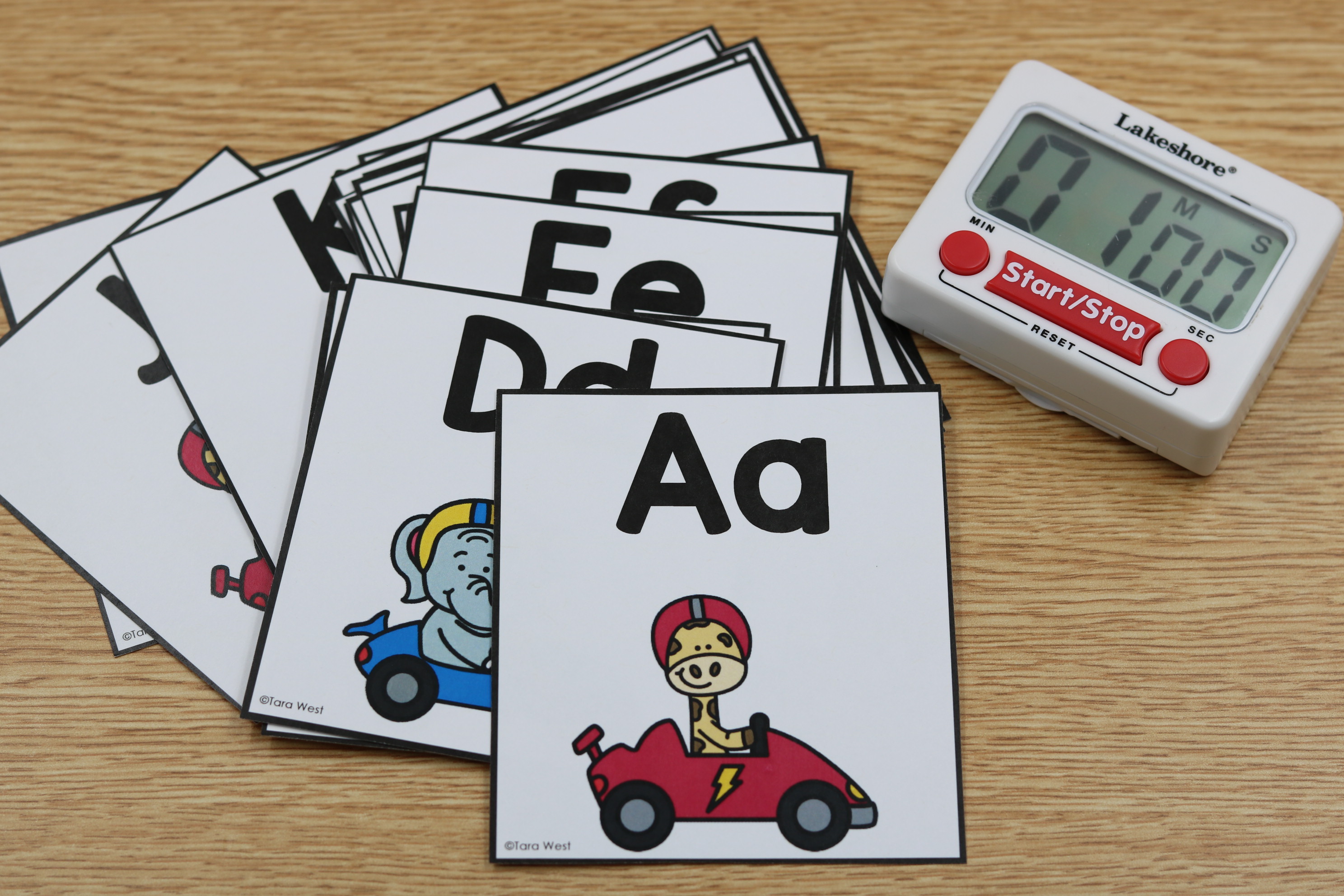 Alphabet fluency flashcards for practicing letter names and sounds with timed drills.