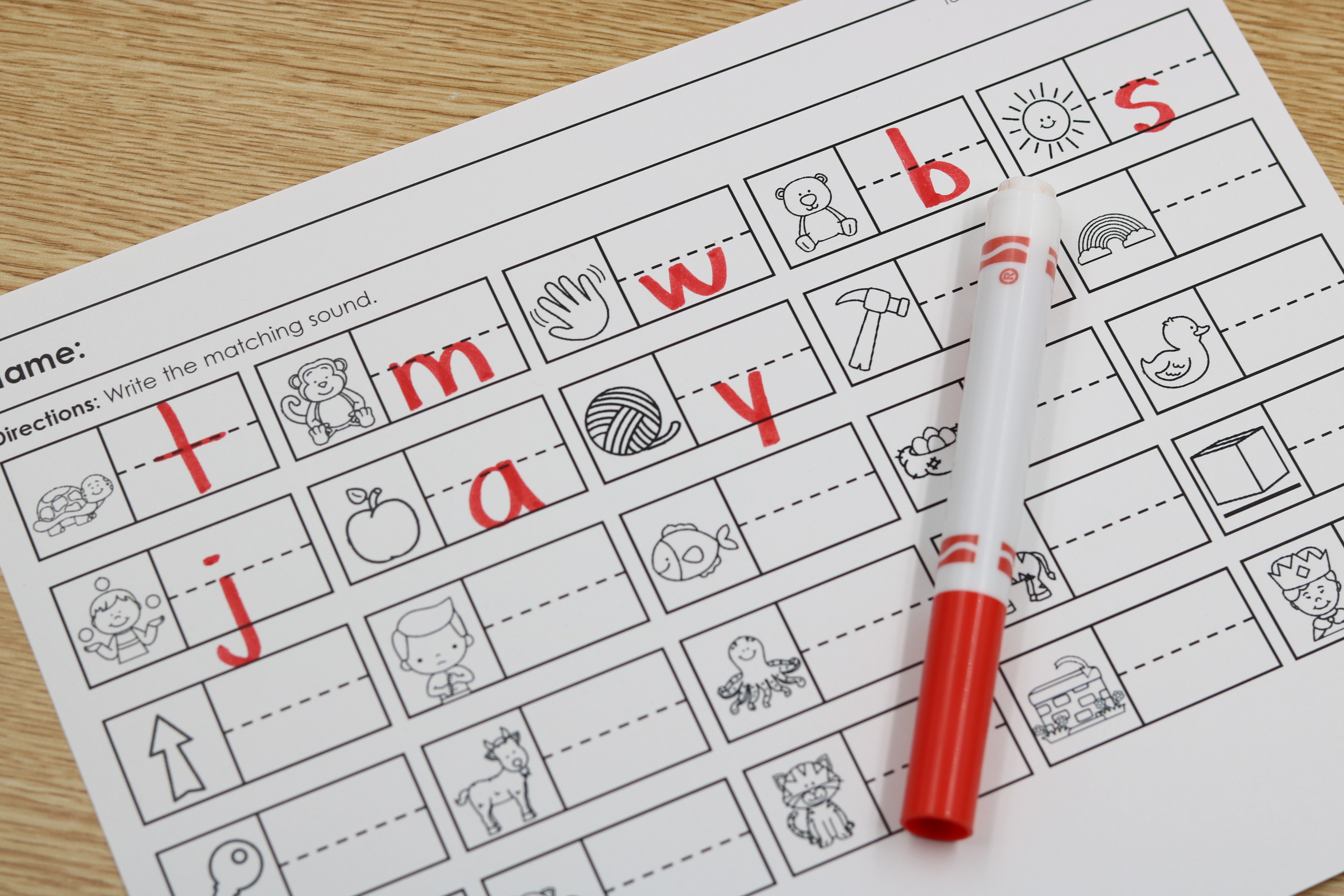 Free phonics alphabet sound assessment page with letter-writing